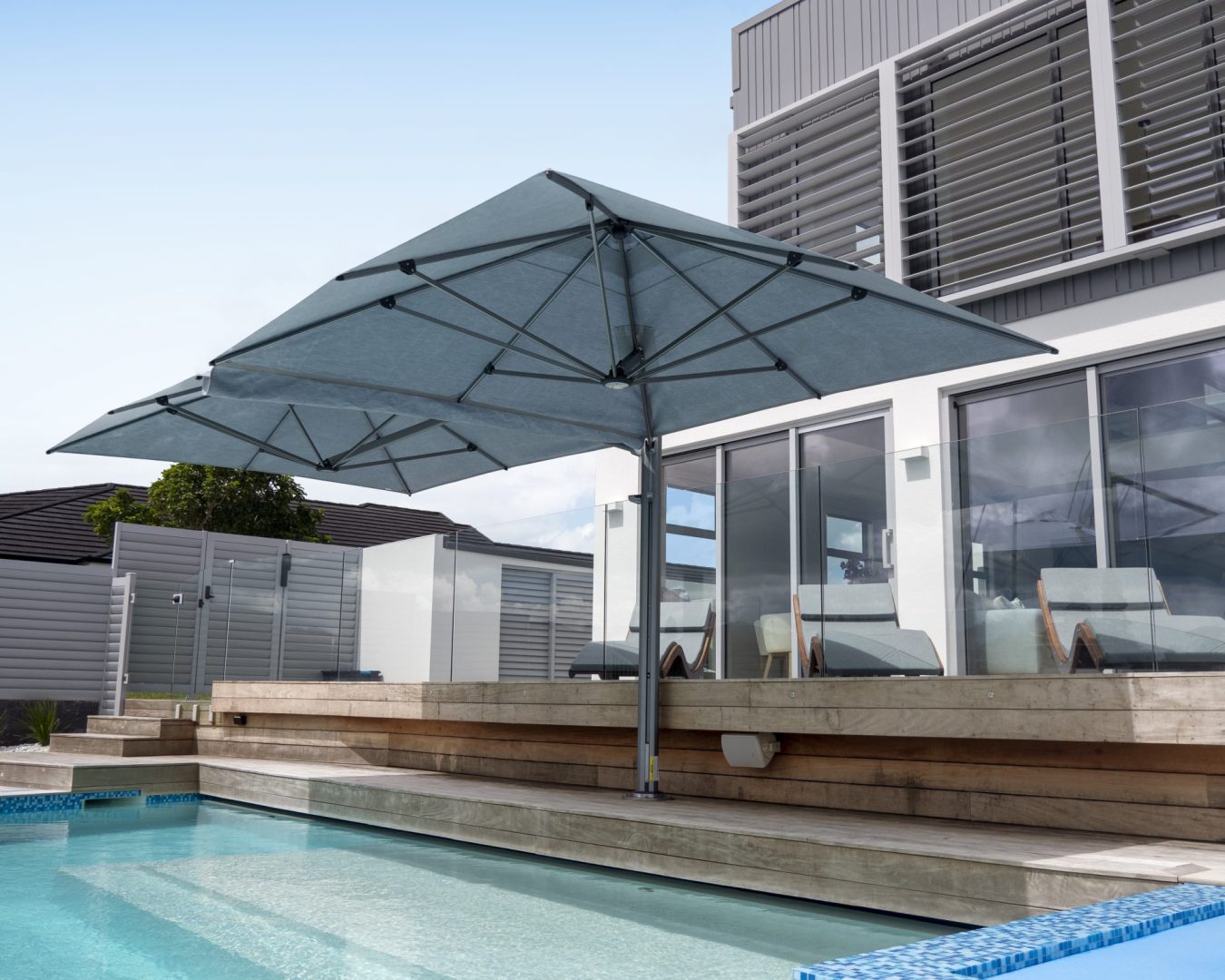 Pool-side-Umbrellas-Sunrise-Blinds